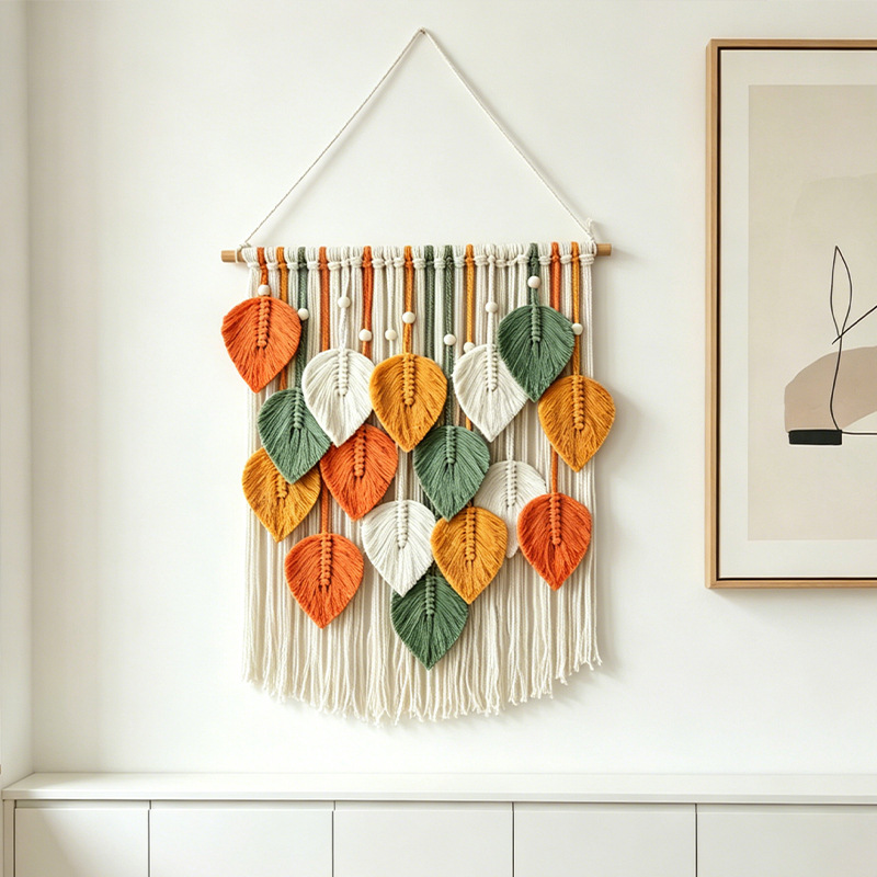 Colorful woven leaf wall hanging above a console in a home